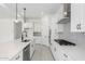 Beautiful kitchen with an island, stainless appliances, and white cabinets at 24152 N 172Nd Ave, Surprise, AZ 85387
