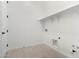 A laundry room with hard surface floors, white walls and plumbing hookups at 24152 N 172Nd Ave, Surprise, AZ 85387