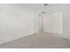 A bright, simple room with white walls, light tile flooring, and recessed lighting overhead at 24152 N 172Nd Ave, Surprise, AZ 85387