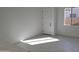 Bright room with tiled flooring, large window, and a white door at 24152 N 172Nd Ave, Surprise, AZ 85387