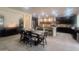 Kitchen and Dining area with tile flooring, dark wood cabinets, and stainless appliances at 24228 S 211Th St, Queen Creek, AZ 85142