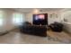 Living room area with multiple leather sofas, neutral tile and recessed lighting at 24228 S 211Th St, Queen Creek, AZ 85142