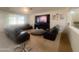 Living room area with multiple leather sofas, neutral carpet and recessed lighting at 24228 S 211Th St, Queen Creek, AZ 85142