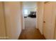 View down hallway into main bedroom featuring a ceiling fan and neutral walls and carpets at 24228 S 211Th St, Queen Creek, AZ 85142