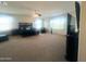 Spacious main bedroom with multiple windows providing natural light and ceiling fan at 24228 S 211Th St, Queen Creek, AZ 85142