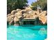 Rock waterfall into swimming pool and rock water slide at 24228 S 211Th St, Queen Creek, AZ 85142