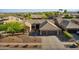 An aerial view of desert home showcases the tile roof, three-car garage, and drought-resistant landscaping at 2449 E Desert Flower Ln, Phoenix, AZ 85048