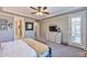 Bright bedroom with en suite bath, walk-in closet and private patio access at 2468 W Dapple Gray Ct, San Tan Valley, AZ 85144