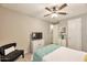 Bedroom with soft carpet, TV on dresser, and ceiling fan at 2468 W Dapple Gray Ct, San Tan Valley, AZ 85144