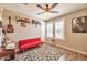 Bedroom with wood flooring, ceiling fan, and bright window at 2468 W Dapple Gray Ct, San Tan Valley, AZ 85144