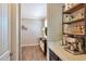 Charming coffee bar area with built-in shelving, a coffee machine, and stylish decor at 2468 W Dapple Gray Ct, San Tan Valley, AZ 85144