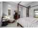 Comfortable bedroom with a four-poster bed and stylish decor at 26699 N 104Th Way, Scottsdale, AZ 85262