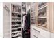 Organized walk-in closet with custom shelves and shoe displays, offering ample storage at 26699 N 104Th Way, Scottsdale, AZ 85262