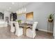 Dining room boasts modern light fixture, and comfortable seating, perfect for entertaining guests at 26699 N 104Th Way, Scottsdale, AZ 85262