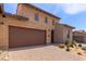 Charming home with a two-car garage, beautiful brickwork and a well-kept desert landscaped yard at 26699 N 104Th Way, Scottsdale, AZ 85262