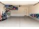 Clean, well-lit garage with epoxy floors, storage shelves, and plenty of room at 26699 N 104Th Way, Scottsdale, AZ 85262