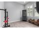 This home gym features plenty of space for equipment and a cabinet at 26699 N 104Th Way, Scottsdale, AZ 85262