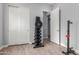 Bright home gym with wood floors, a weight rack, and sliding closet doors at 26699 N 104Th Way, Scottsdale, AZ 85262