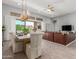 Open floor plan featuring dining area and living room with an oversized sliding glass door at 26699 N 104Th Way, Scottsdale, AZ 85262