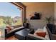 Covered patio with comfortable seating, fire pit, and tranquil views at 26699 N 104Th Way, Scottsdale, AZ 85262