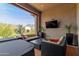Outdoor living space with comfortable seating, a hot tub, and mountain views at 26699 N 104Th Way, Scottsdale, AZ 85262