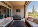 Relaxing covered patio with hot tub, lounge chairs, and desert views at 26699 N 104Th Way, Scottsdale, AZ 85262