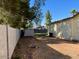 Fenced yard showing a storage shed and some sparse ground cover at 2834 E Juanita Ave, Mesa, AZ 85204