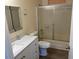 Bathroom features a shower with sliding doors and a light-colored vanity at 2834 E Juanita Ave, Mesa, AZ 85204
