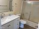 Well-lit bathroom with a modern vanity, sink and faucet and a shower with sliding doors at 2834 E Juanita Ave, Mesa, AZ 85204