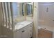 Bathroom featuring vanity with white cabinets and a shower at 2834 E Juanita Ave, Mesa, AZ 85204