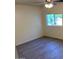 Bedroom features light walls, wood-look floors and a ceiling fan at 2834 E Juanita Ave, Mesa, AZ 85204