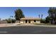 Exterior shot of single story home featuring desert landscaping, mature trees, and an inviting front entrance at 2834 E Juanita Ave, Mesa, AZ 85204