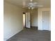 Spacious living room features neutral walls, ceiling fan and light gray wood floor at 2834 E Juanita Ave, Mesa, AZ 85204