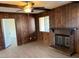 Living room features wood paneled walls, a brick fireplace and a ceiling fan at 2834 E Juanita Ave, Mesa, AZ 85204
