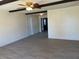 Living room features faux wood flooring and dark wood decorative beams at 2834 E Juanita Ave, Mesa, AZ 85204