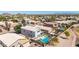An aerial view highlights a home with a backyard pool and views of the community golf course at 29051 N Shannon Dr, San Tan Valley, AZ 85143