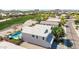 A high aerial view shows a home's backyard pool adjacent to the community golf course at 29051 N Shannon Dr, San Tan Valley, AZ 85143