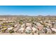 Wide drone shot featuring mountain views and the homes and community in the foreground at 29051 N Shannon Dr, San Tan Valley, AZ 85143