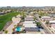 An aerial shot shows the property's backyard pool adjacent to the community golf course at 29051 N Shannon Dr, San Tan Valley, AZ 85143