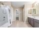 Neutral bathroom with a shower/tub combo, a large vanity, and walk in closet at 29051 N Shannon Dr, San Tan Valley, AZ 85143