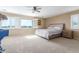Bright bedroom features a ceiling fan, a large window with shutters and neutral walls at 29051 N Shannon Dr, San Tan Valley, AZ 85143