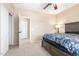 Bedroom featuring a nightstand with a lamp, doors to the hallway and a closet at 29051 N Shannon Dr, San Tan Valley, AZ 85143