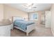 Cozy bedroom with neutral tones, carpet, and a ceiling fan, offering a relaxing retreat at 29051 N Shannon Dr, San Tan Valley, AZ 85143