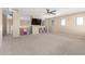 Spacious bonus room with neutral walls, carpet, and a ceiling fan, providing a relaxing vibe at 29051 N Shannon Dr, San Tan Valley, AZ 85143