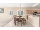 Bright dining room features tile flooring, neutral walls, and a modern light fixture at 29051 N Shannon Dr, San Tan Valley, AZ 85143