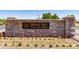 Entrance to Indigo Sky Recreation Center with stone wall and desert landscaping at 29051 N Shannon Dr, San Tan Valley, AZ 85143