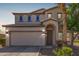 Charming two-story home with a two-car garage and beautifully landscaped front yard at 29051 N Shannon Dr, San Tan Valley, AZ 85143