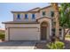 Charming two-story home with a two-car garage and beautifully landscaped front yard at 29051 N Shannon Dr, San Tan Valley, AZ 85143