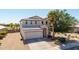 A house featuring a well-manicured lawn and a desert landscape at 29051 N Shannon Dr, San Tan Valley, AZ 85143