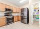 Well-equipped kitchen with stainless steel appliances and a spacious walk-in pantry at 29051 N Shannon Dr, San Tan Valley, AZ 85143